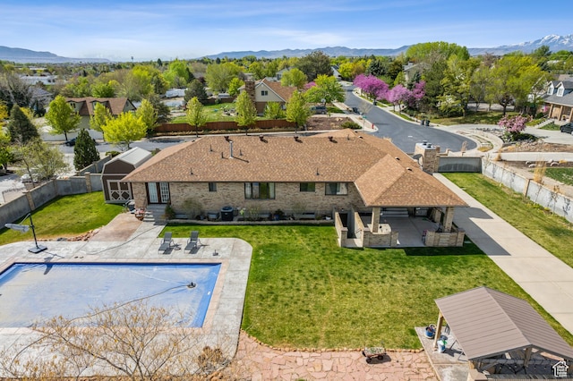 3902 W Angus Dr, South Jordan, UT 84009 - aerial perspective of suburban area featuring a pool and a mountainous background