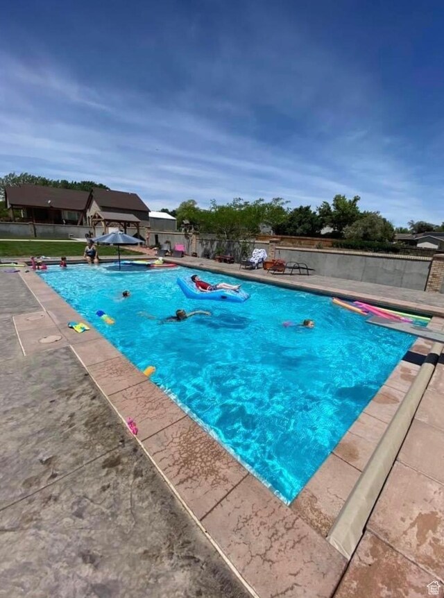 3902 W Angus Dr, South Jordan, UT 84009 - view of swimming pool featuring a diving board, fence, and a patio