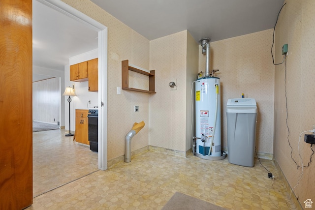 utility room featuring water heater
