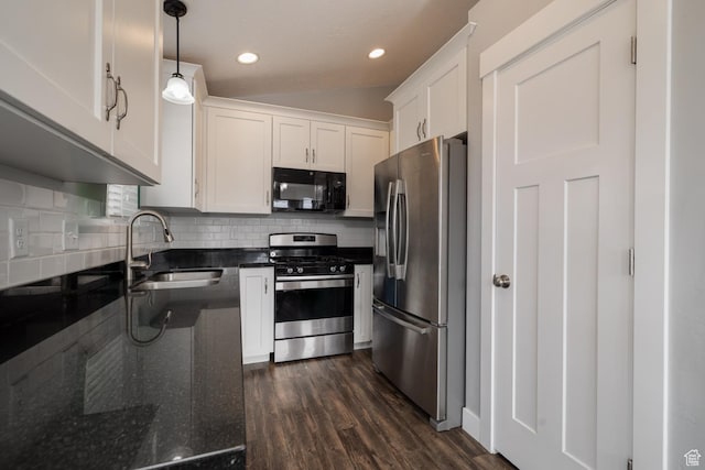 46501 W Bandanna Dr, Fruitland, UT 84027 - kitchen featuring decorative backsplash, appliances with stainless steel finishes, dark wood-style floors, white cabinetry, and a sink