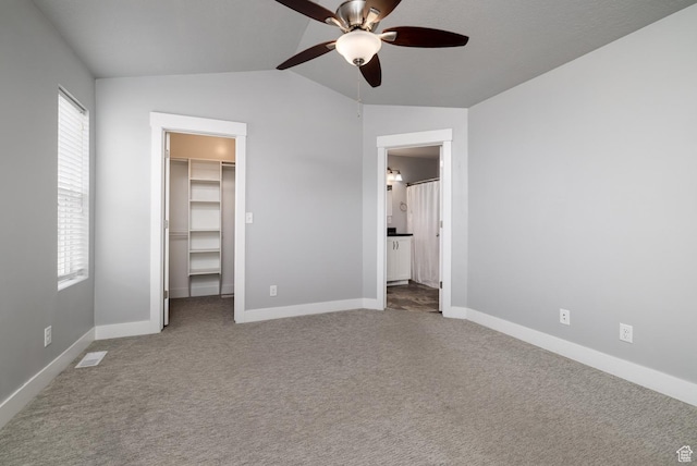 46501 W Bandanna Dr, Fruitland, UT 84027 - unfurnished bedroom featuring a spacious closet, carpet flooring, baseboards, and lofted ceiling