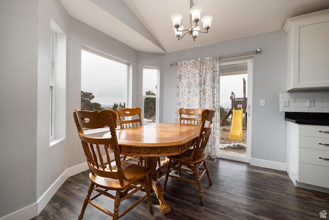 46501 W Bandanna Dr, Fruitland, UT 84027 - dining room with dark wood finished floors, lofted ceiling, baseboards, and an inviting chandelier