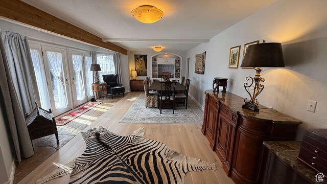 82 W 500 N, Vernal, UT 84078 - dining area featuring baseboards, arched walkways, light wood-style flooring, and french doors