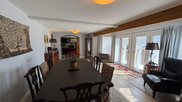82 W 500 N, Vernal, UT 84078 - dining space featuring arched walkways, wood finished floors, french doors, and beamed ceiling