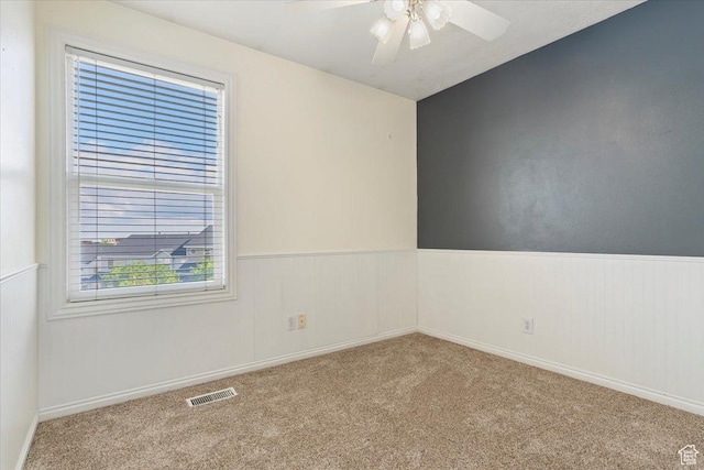 173 E Irisfield Dr S, Draper, UT 84020 - spare room with carpet, a ceiling fan, and wainscoting