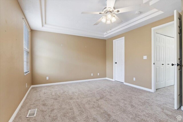 173 E Irisfield Dr S, Draper, UT 84020 - unfurnished bedroom featuring a raised ceiling, carpet flooring, baseboards, and a ceiling fan