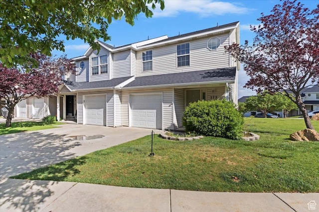 173 E Irisfield Dr S, Draper, UT 84020 - view of property with driveway, a front lawn, and an attached garage
