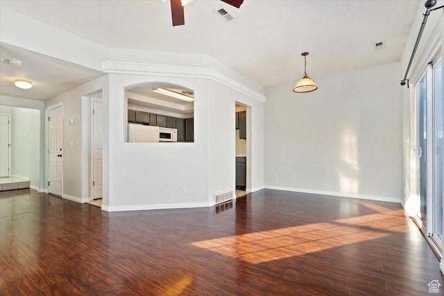 173 E Irisfield Dr S, Draper, UT 84020 - unfurnished living room with dark wood finished floors, ceiling fan, and baseboards