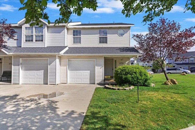173 E Irisfield Dr S, Draper, UT 84020 - townhome / multi-family property featuring driveway, an attached garage, and a front yard