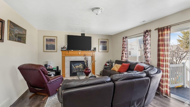 5254 W Ted Way, West Valley City, UT 84120 - living room with a wealth of natural light, a tile fireplace, baseboards, and wood finished floors