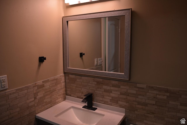 4023 W Severn Cir S, Jordan, UT 84009 - bathroom featuring tile walls, vanity, and tasteful backsplash