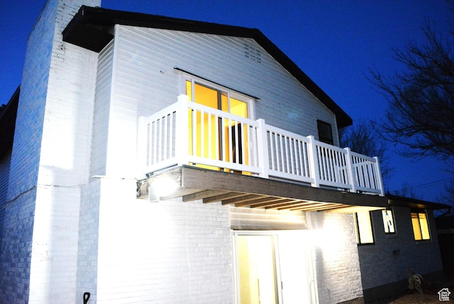 4023 W Severn Cir S, Jordan, UT 84009 - back of house at night with brick siding
