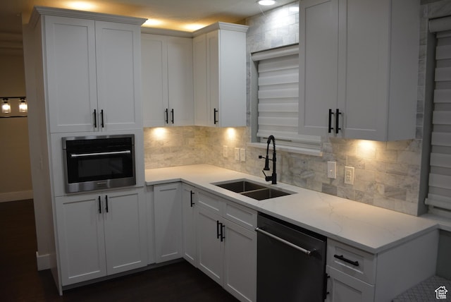 4023 W Severn Cir S, Jordan, UT 84009 - kitchen featuring dishwasher, a sink, oven, white cabinetry, and tasteful backsplash