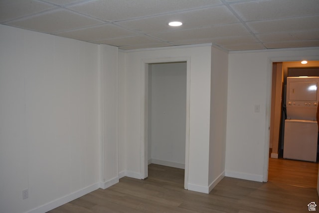 4023 W Severn Cir S, Jordan, UT 84009 - spare room with stacked washer / dryer, a paneled ceiling, wood finished floors, baseboards, and recessed lighting