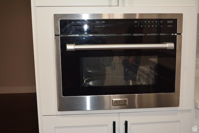 4023 W Severn Cir S, Jordan, UT 84009 - kitchen view of white cabinetry and oven