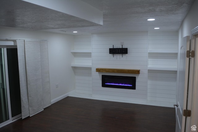 4023 W Severn Cir S, Jordan, UT 84009 - unfurnished living room featuring a textured ceiling, wood finished floors, recessed lighting, a glass covered fireplace, and baseboards