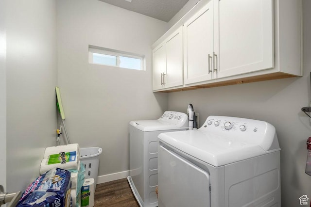 4268 S Steele Creek Ct E, Millcreek, UT 84107 - washroom featuring separate washer and dryer, cabinet space, dark wood-style flooring, and baseboards