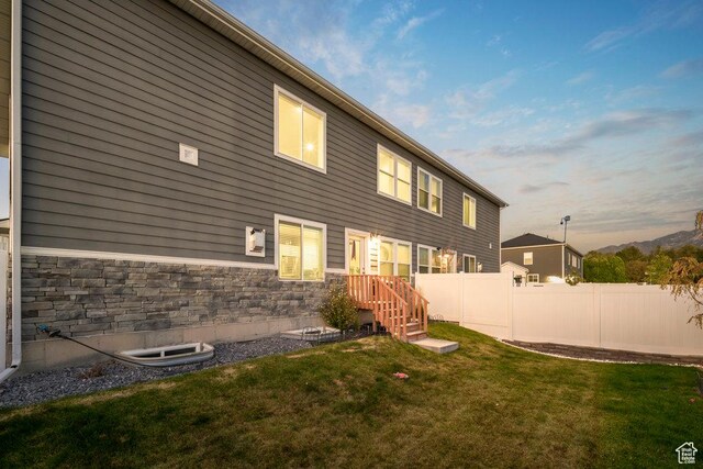 4268 S Steele Creek Ct E, Millcreek, UT 84107 - back of property at dusk with stone siding