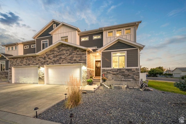 4268 S Steele Creek Ct E, Millcreek, UT 84107 - view of front of property with stone siding, concrete driveway, and board and batten siding