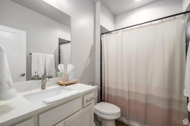 4268 S Steele Creek Ct E, Millcreek, UT 84107 - bathroom featuring vanity, toilet, and a shower with shower curtain