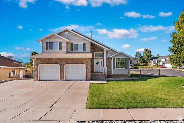 965 E 3400 N, Layton, UT 84040 - view of front of home with brick siding, concrete driveway, a front yard, and a garage