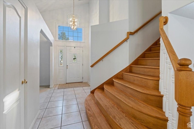 965 E 3400 N, Layton, UT 84040 - foyer entrance with a towering ceiling, stairway, light tile patterned floors, baseboards, and a chandelier