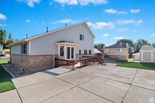 965 E 3400 N, Layton, UT 84040 - rear view of house featuring a wooden deck, a yard, french doors, a patio area, and brick siding