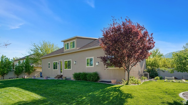 125 N 1430 E, Spanish Fork, UT 84660 - back of property with stucco siding, cooling unit, entry steps, and a shingled roof