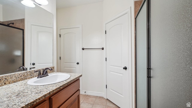 125 N 1430 E, Spanish Fork, UT 84660 - bathroom featuring vanity, tile patterned flooring, and a shower with shower door
