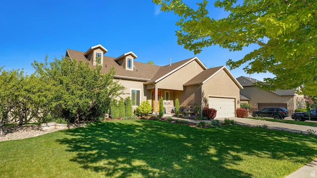 125 N 1430 E, Spanish Fork, UT 84660 - view of front of home featuring stucco siding, a garage, a front yard, and driveway