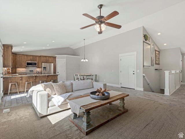 361 W 200 N, Heber City, UT 84032 - living area with vaulted ceiling, a ceiling fan, a chandelier, baseboards, and light carpet