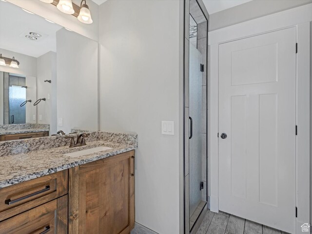 361 W 200 N, Heber City, UT 84032 - bathroom with a stall shower, vanity, and wood finished floors
