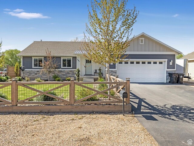 361 W 200 N, Heber City, UT 84032 - ranch-style home with stone siding, asphalt driveway, and a fenced front yard