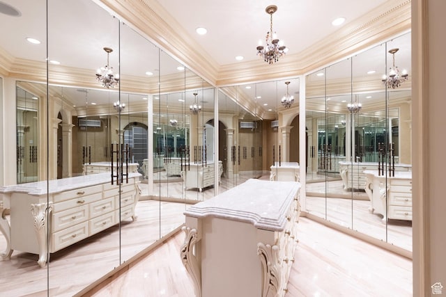 8272 Left Fork Hobble Creek Rd, Springville, UT 84663 - spacious closet featuring an inviting chandelier, arched walkways, and light wood finished floors