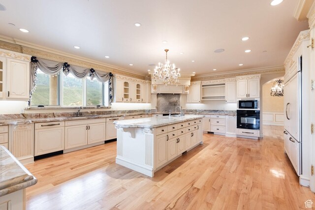 8272 Left Fork Hobble Creek Rd, Springville, UT 84663 - kitchen featuring light wood finished floors, a sink, black appliances, crown molding, and a chandelier