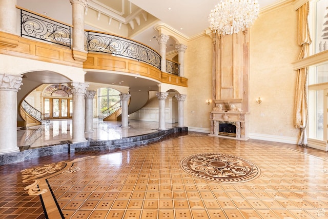 8272 Left Fork Hobble Creek Rd, Springville, UT 84663 - unfurnished living room with decorative columns, baseboards, and a high ceiling