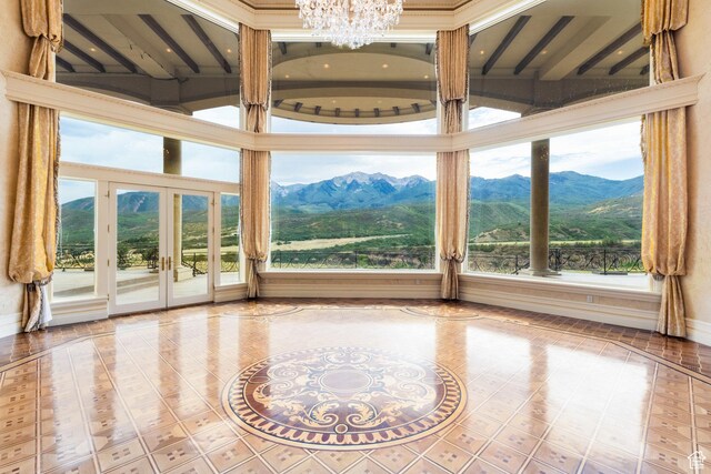 8272 Left Fork Hobble Creek Rd, Springville, UT 84663 - unfurnished sunroom with an inviting chandelier, french doors, and a mountain view