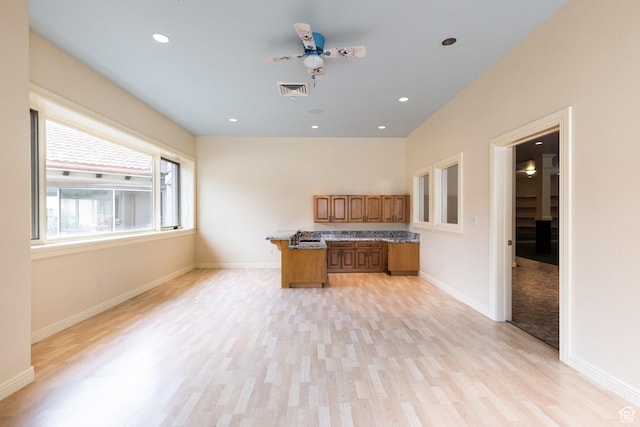 8272 Left Fork Hobble Creek Rd, Springville, UT 84663 - kitchen featuring recessed lighting, baseboards, brown cabinets, and light wood finished floors