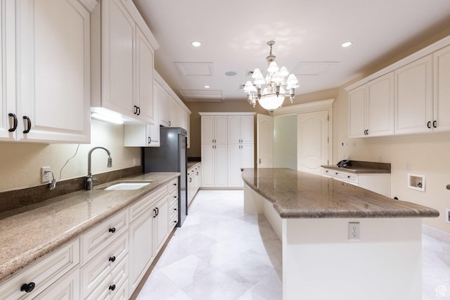 8272 Left Fork Hobble Creek Rd, Springville, UT 84663 - kitchen featuring recessed lighting, light stone countertops, a center island, and a sink