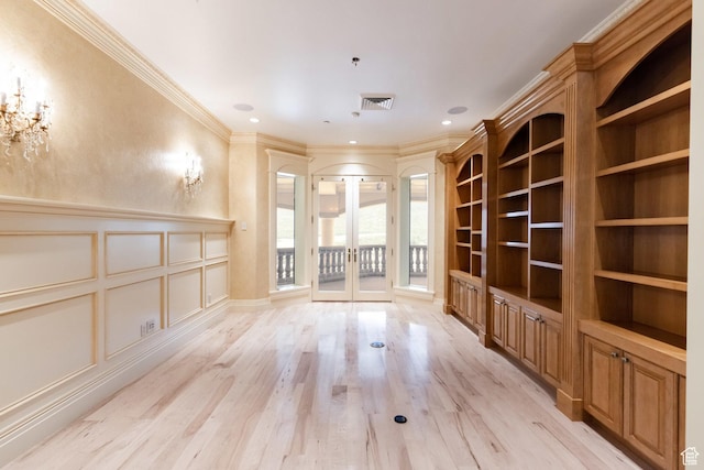 8272 Left Fork Hobble Creek Rd, Springville, UT 84663 - unfurnished living room featuring visible vents, crown molding, french doors, light wood-style floors, and a decorative wall