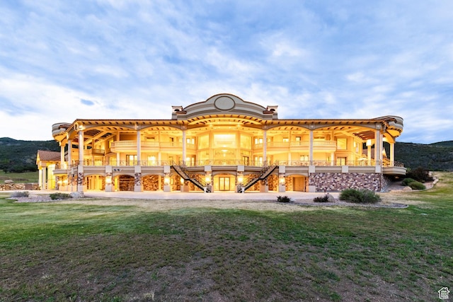 8272 Left Fork Hobble Creek Rd, Springville, UT 84663 - rear view of house featuring a mountain view, stone siding, and a lawn