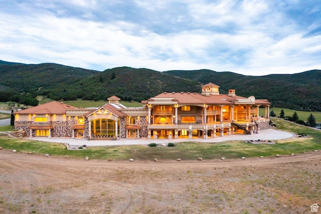 8272 Left Fork Hobble Creek Rd, Springville, UT 84663 - back of property featuring a mountain view, stone siding, and a chimney