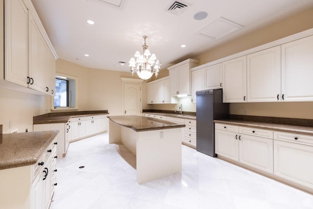 8272 Left Fork Hobble Creek Rd, Springville, UT 84663 - kitchen with visible vents, decorative light fixtures, dark stone counters, recessed lighting, and refrigerator