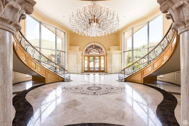 8272 Left Fork Hobble Creek Rd, Springville, UT 84663 - entrance foyer featuring marble finish floor, crown molding, stairs, and a high ceiling