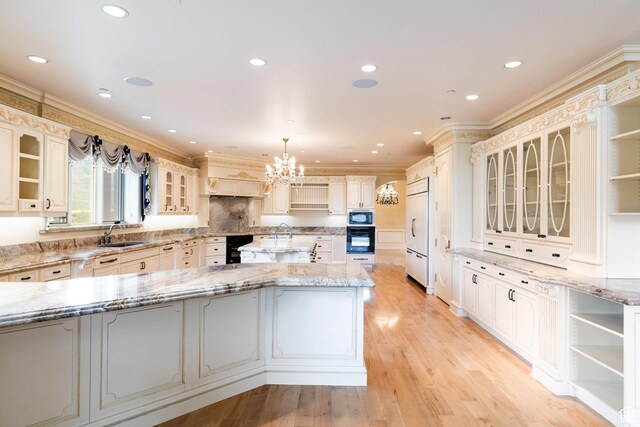 8272 Left Fork Hobble Creek Rd, Springville, UT 84663 - kitchen with light wood finished floors, open shelves, a sink, built in appliances, and crown molding