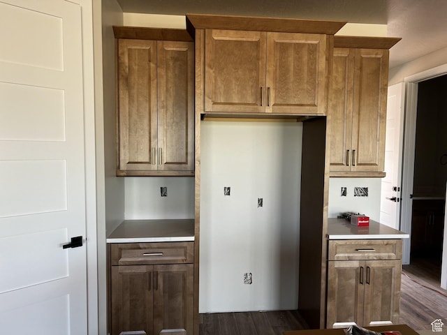 4810 W 1930 S, Hurricane, UT 84737 - kitchen with dark wood-type flooring, light countertops, and brown cabinets
