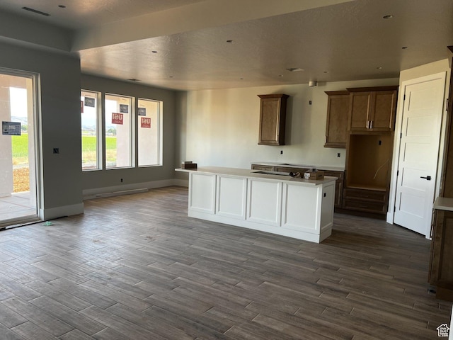 4810 W 1930 S, Hurricane, UT 84737 - kitchen featuring dark wood finished floors, baseboards, and a center island