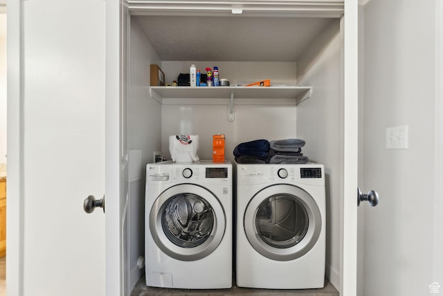 washroom with laundry area and washing machine and clothes dryer