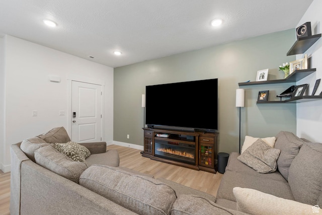 899 N 1330 E, Spanish Fork, UT 84660 - living area with recessed lighting, wood finished floors, baseboards, and a textured ceiling