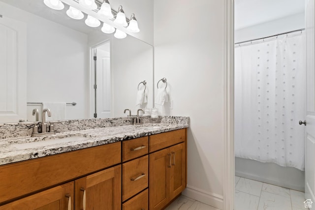 1251 N 2525 W, Clinton, UT 84015 - bathroom with double vanity, baseboards, marble finish floor, and a sink